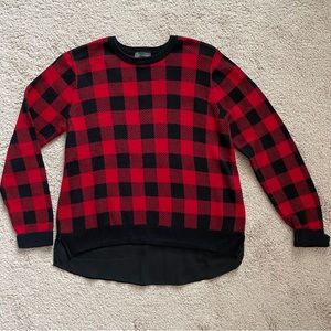 Red and black plaid sweater with appearance of sheer black shirt underneath